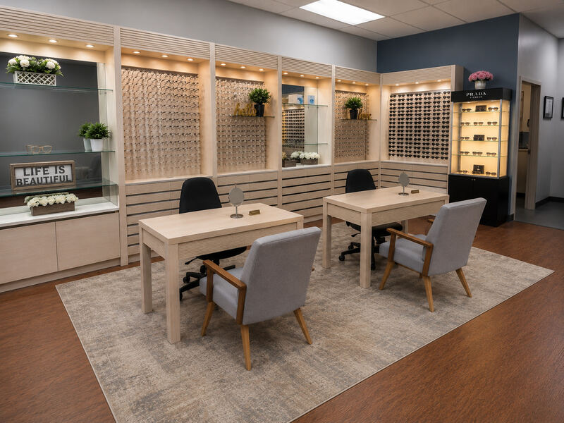 Optical showroom with eyewear displays and consultation tables