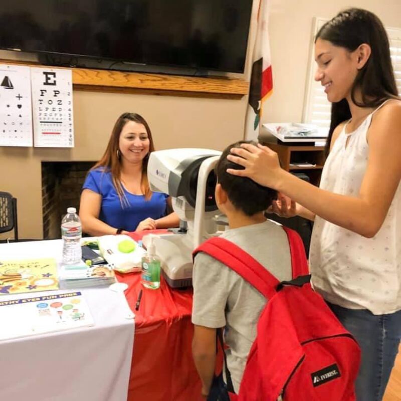 Volunteers supporting a community vision care event